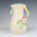 A Clarice Cliff moulded jug decorated with flowers no.907 23cm