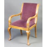 An Italian style bleached walnut show frame open arm chair raised on cabriole supports 97cm h x 61cm