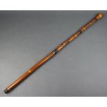 A Chinese carved bamboo walking stick decorated 4 portraits and signed to the base 89cm l There is a