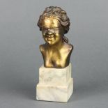 An Art Nouveau erotic spelter head and shoulders portrait bust of a blindfolded lady raised on a
