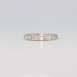 An 18ct white gold 10 stone baguette ring, each stone approx. 0.01ct, 2.6 grams, size L 1/2