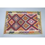 A red, brown and green ground Maimana Kilim rug 150cm x 100cm