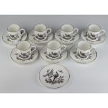 A set of 7 Royal Worcester coffee cans and 8 saucers decorated with exotic birds