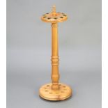 A 20th Century Victorian style turned oak 10 aperture snooker cue stand with turned finial 80cm x