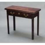 A Georgian mahogany tea table fitted a frieze drawer, raised on square supports 75cm h x 90cm w x