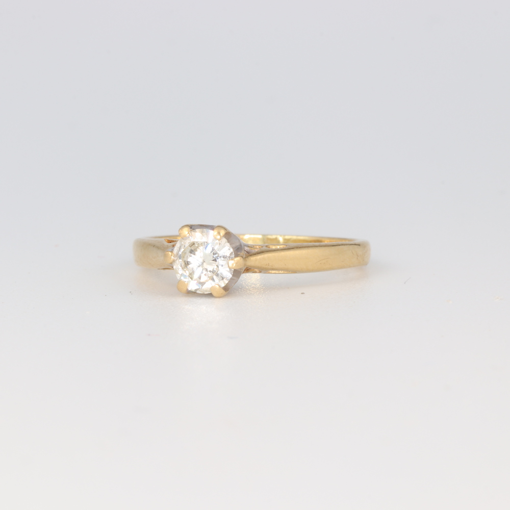 A yellow metal 18k single stone diamond ring, size K, 2.8 grams, approx. 0.5ct