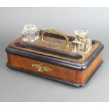 A Victorian walnut and ebonised standish with 2 associated cut glass bottles (chipped) and pen
