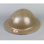 A World War Two steel helmet marked 32