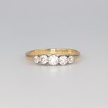 An 18ct yellow gold 5 stone graduated diamond ring, size M 1/2, 2.5 grams, approx. 0.6ct The