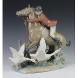 A Lladro figure "The Race" 31cm The tail has been stuck and 1 birds wing has a minor chip