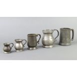 A Victorian pewter pint tankard marked 1826, a Victorian baluster shaped pint tankard, ditto half