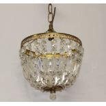 A circular gilt metal bag shaped light fitting hung lozenges 25cm h x 24cm diam.