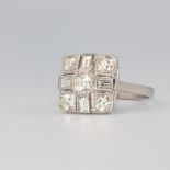 A platinum Art Deco style baguette and brilliant cut diamond ring size M, 1.3ct, 6.1 grams