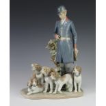 A Lladro group of huntsman and hounds no.751 decorated by J Ruiz, 32cm