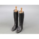 A pair of black leather riding boots complete with trees Signs of old but treated worm to 1 tree