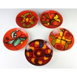 Five 1970's Poole red ground dishes with abstract decoration 20cm