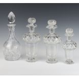 A pair of cut glass thistle shaped decanters and stoppers 26cm (1 chipped lip), a smaller ditto 19cm