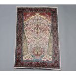 A North West Persian silk, white, green and red ground prayer rug 117cm x 77cm Signs of wear,