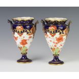 A pair of Royal Crown Derby Imari pattern 2 handled tapered vases decorated with flowers 16cm