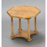 A Philadelphia style American octagonal maple 2 tier occasional table raised on a turned column with