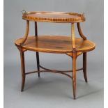 An Edwardian inlaid rosewood oval 2 tier etagere raised on outswept supports with X frame stretcher,