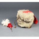 A reproduction Victorian Busby complete with red bag, chin strap and associated heckle/plume 25cm