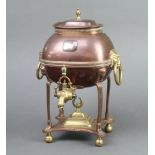 A Regency copper and brass tea urn with ring drop handles, raised on bun feet 30cm h x 20cm w x 16cm