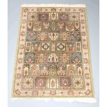 A machine made blue and brown ground Persian style rug formed of numerous panels 196cm x 143cm