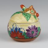 A Clarice Cliff Bizarre Gayday pattern preserve pot and cover with floral handle, 9cm The lid is