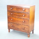 A Victorian mahogany chest of 4 drawers with tore handles and brass escutcheons, raised on turned