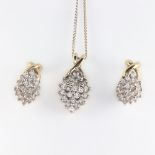 A 9ct yellow gold diamond marquise shaped pendant on a silver chain together with a pair of matching