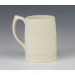 A Keith Murray Wedgwood white glaze mug with beaded decoration, tinted marks 13cm There is a small