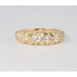 A Victorian style yellow metal 18ct, 5 stone graduated diamond ring 1.3ct, size O, 6 grams, with WGI