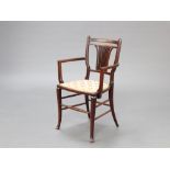 An Edwardian inlaid mahogany stick and rail back open arm chair with upholstered seat 85cm h x