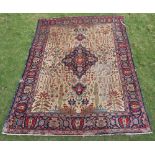 A sand and blue ground Tabriz carpet with central medallion within multi row border 385cm x 280cm