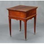 Alexander Clark, a 1920's square mahogany surprise table with hinged lid, raised on square