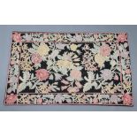 A black, white and pink ground Kashmir style floral stitchwork panel 145cm x 90cm