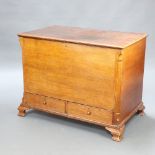 An 18th/19th Century light oak mule chest with hinged lid, the base fitted 2 drawers with tore