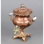 A Georgian copper twin handled tea urn complete with lead slug and glass isolating handles 33cm h