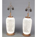 A pair of 20th Century Chinese white glazed reticulated table lamps 35cm
