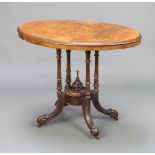 A Victorian oval quarter veneered inlaid walnut occasional table raised on a turned column and