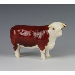 A Beswick Hereford Cow no.1360 modelled by Arthur Greddington 10.8cm, brown and white gloss
