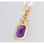 A 9ct yellow gold amethyst pendant 15mm, 0.7 grams