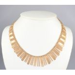 An 18ct yellow gold engine turned tapered necklace, 51 grams, 42cm
