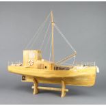 A wooden model of a fishing boat 44cm x 55cm x 22cm