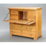 A Victorian pitch pine secretaire chest the fall front above 9 shallow drawers, the base fitted 3