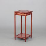 A square Chinese hardwood 2 tier occasional table raised on turned supports 55cm h x 25cm w x 25cm d