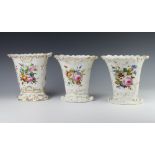 A trio of 19th Century vases decorated with spring flowers and gilt highlights 21cm and a pair 20cm