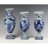 A pair of Delft baluster vases decorated with portrait panels 27cm together with a taller ditto
