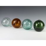 Four coloured glass fishing floats